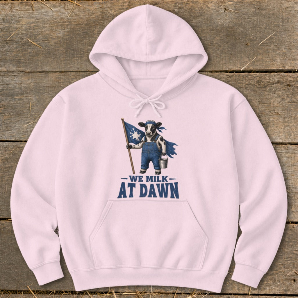 Pink hoodie with graphic of cow holding flag and text "We Milk At Dawn".