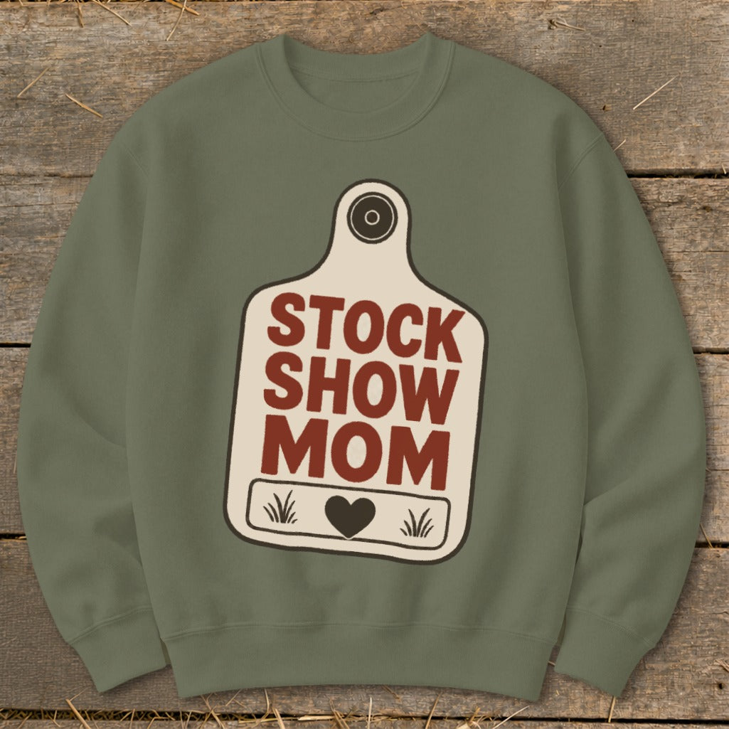 Olive green sweatshirt with a cream tag graphic that reads "STOCK SHOW MOM".