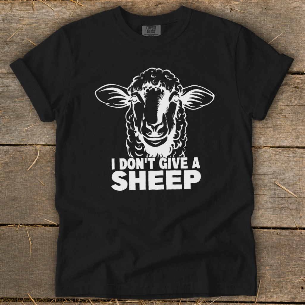 Black t-shirt with white sheep graphic and text "I DON'T GIVE A SHEEP."