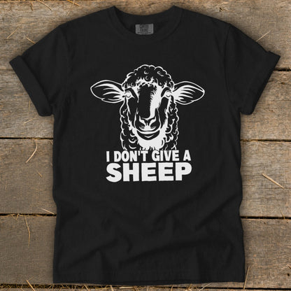 Black t-shirt with white sheep graphic and text "I DON'T GIVE A SHEEP."