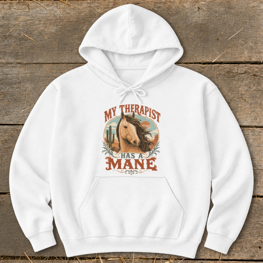 White hoodie with "My Therapist Has A Mane" graphic featuring a horse and desert landscape.