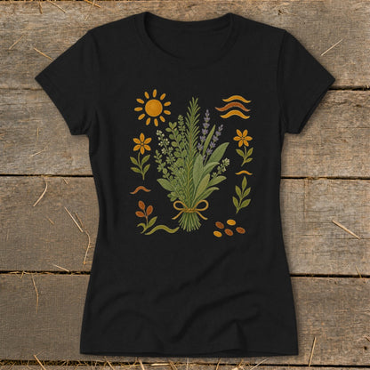 Black t-shirt with a botanical illustration of herbs, flowers, sun, and wavy lines.