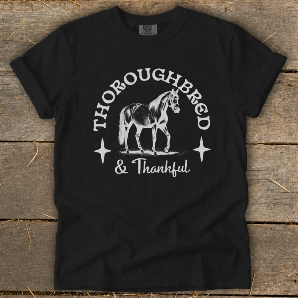 Black t-shirt with "Thoroughbred & Thankful" text and horse graphic.