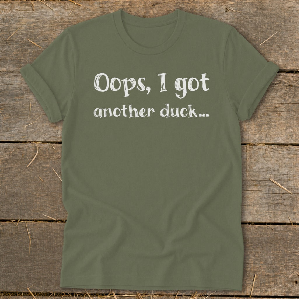 Olive green t-shirt with white text reading "Oops, I got another duck..."