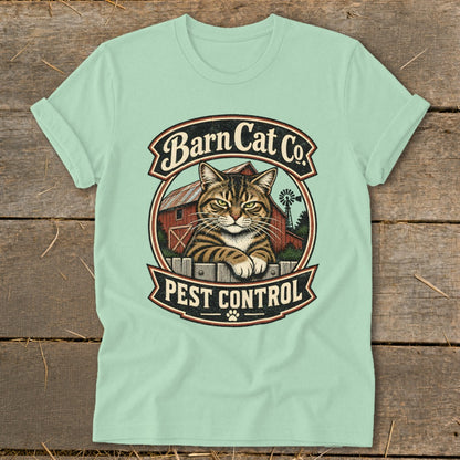 Mint green t-shirt featuring a circular graphic with a tabby cat, barn, and text reading Barn Cat Co. Pest Control.