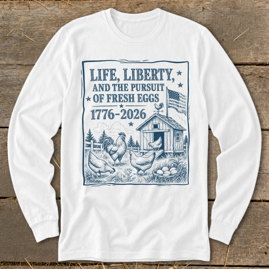 Long sleeve shirt with "Life, Liberty, and the Pursuit of Fresh Eggs 1776-2026" graphic.