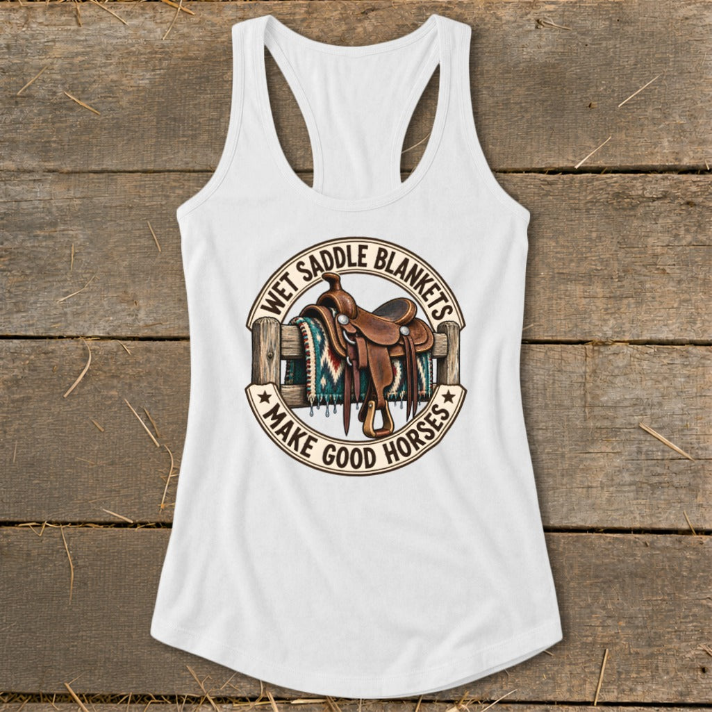 White tank top with a graphic of a saddle on a fence, text reads "Wet Saddle Blankets Make Good Horses".