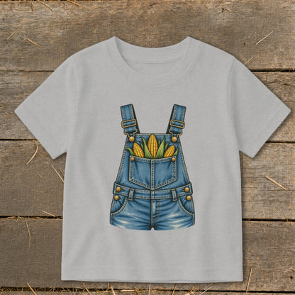 Light grey t-shirt with a denim overalls graphic filled with corn.
