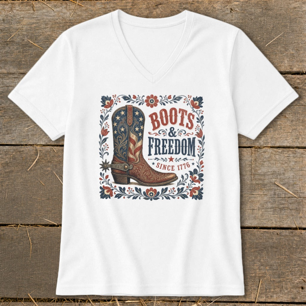 White t-shirt with a graphic of a patriotic cowboy boot and "Boots & Freedom Since 1776" text.