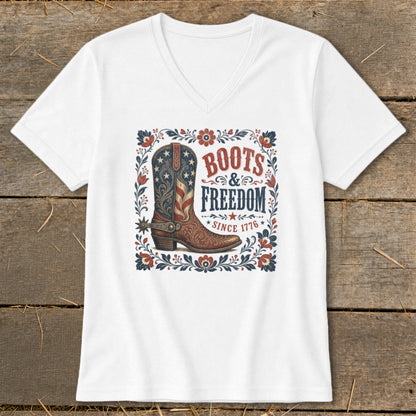 White t-shirt with a graphic of a patriotic cowboy boot and "Boots & Freedom Since 1776" text.
