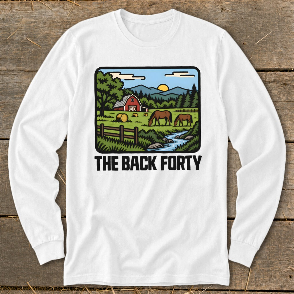 A white long-sleeved t-shirt features a colorful graphic of a farm scene with horses, hay bales, and the text The Back Forty.