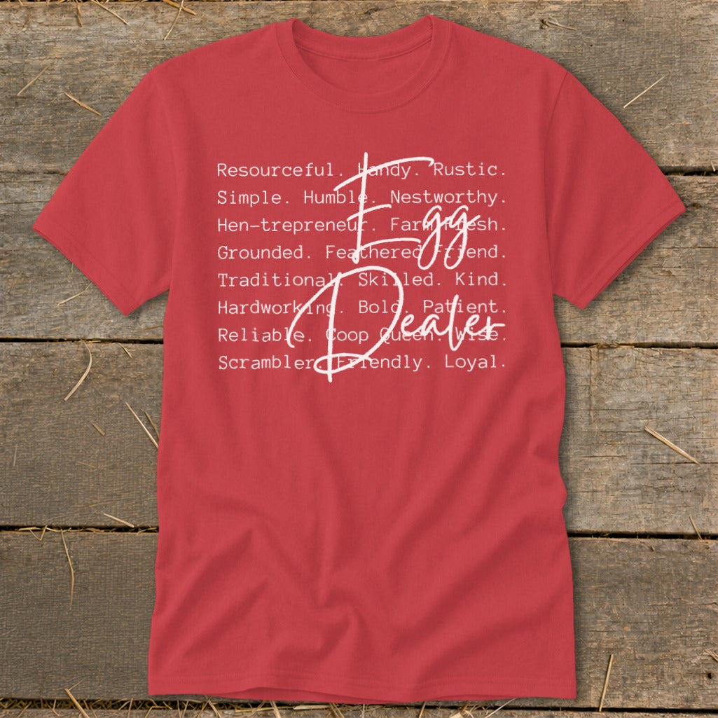 Red t-shirt with white text listing traits like "Resourceful," "Handy," and "Egg Dealer."
