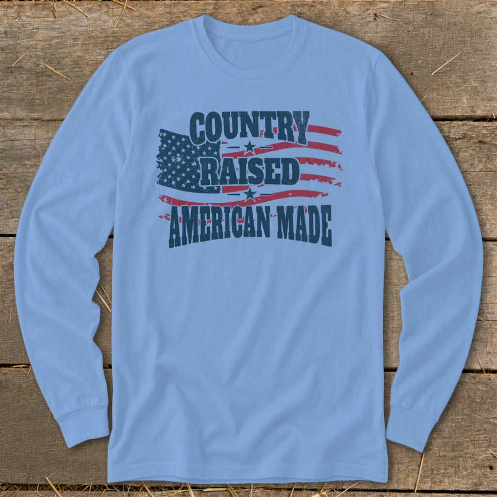 Light blue long sleeve shirt with distressed American flag graphic and text.