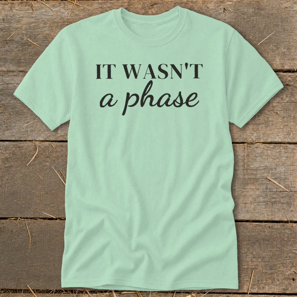 Light mint t-shirt with black text "IT WASN'T a phase".