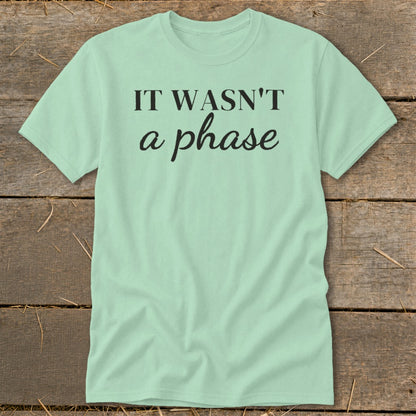 Light mint t-shirt with black text "IT WASN'T a phase".