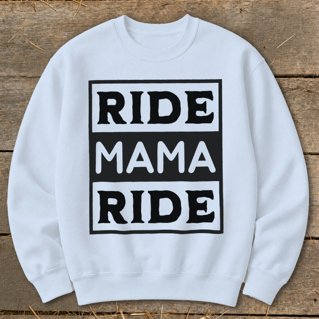 White sweatshirt with black text reading "RIDE MAMA RIDE" in stacked boxes.