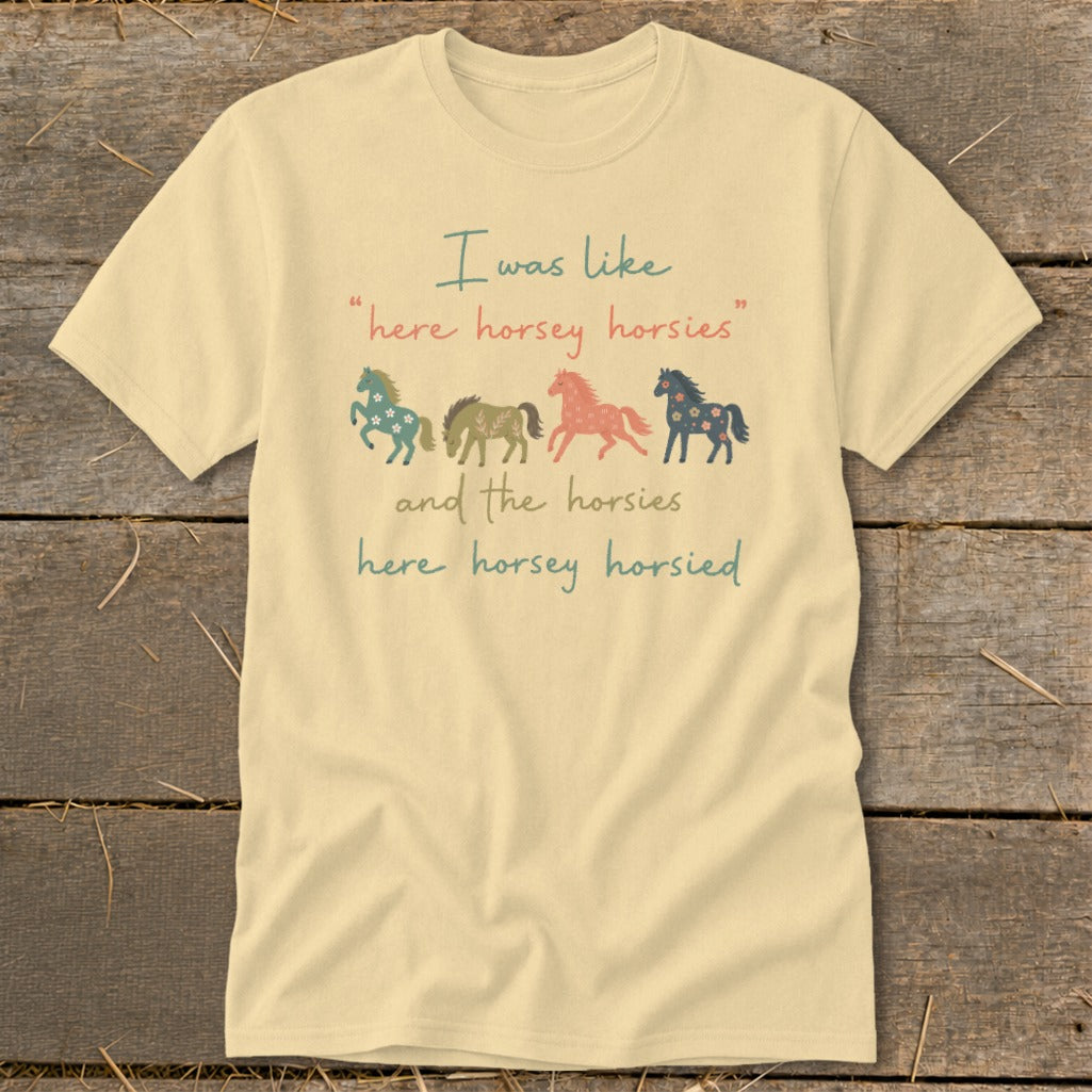 Cream t-shirt with four colorful horses and text "I was like here horsey horsies".