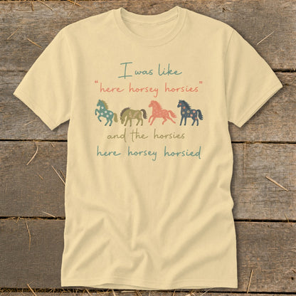Cream t-shirt with four colorful horses and text "I was like here horsey horsies".