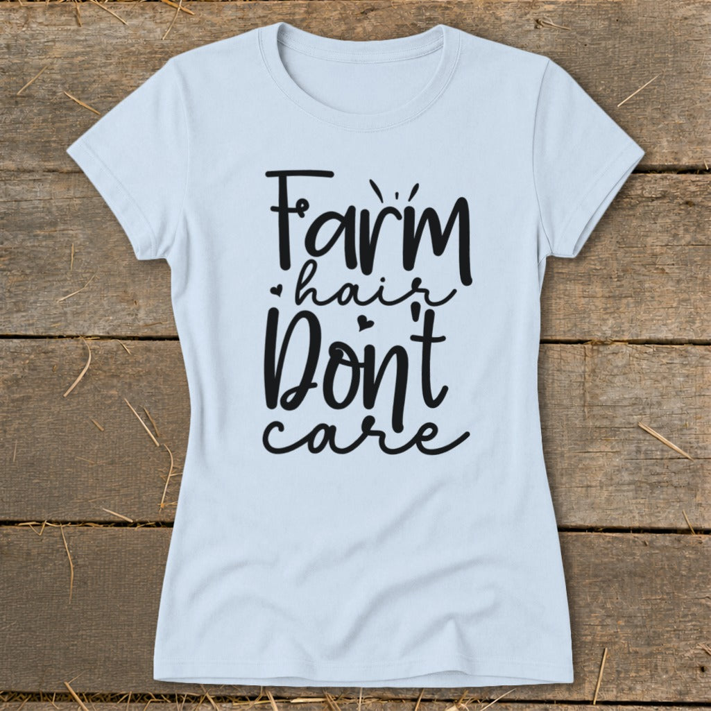 Light blue t-shirt with "Farm hair don't care" in black script.