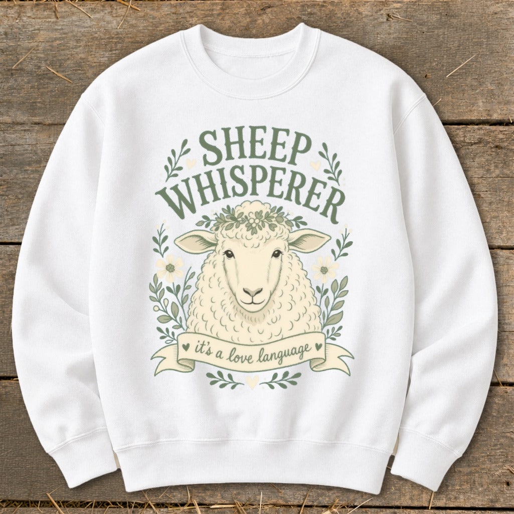 White sweatshirt with a sheep graphic and text "Sheep Whisperer it's a love language".