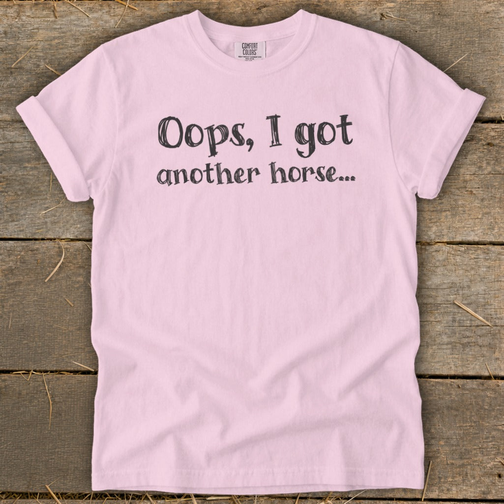 Pink t-shirt with text "Oops, I got another horse...".