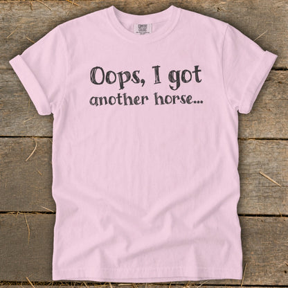 Pink t-shirt with text "Oops, I got another horse...".