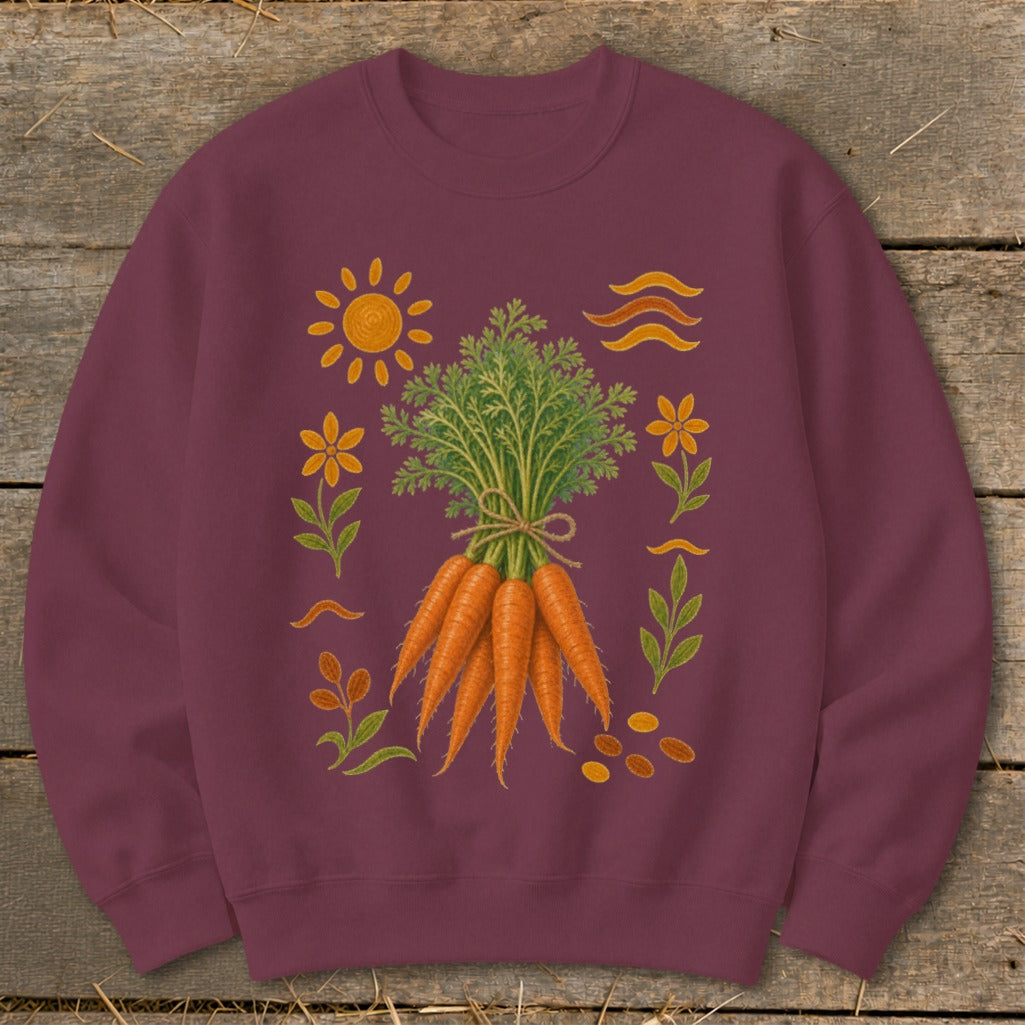 Burgundy sweatshirt with a print of a bunch of carrots, sun, flowers, and wavy lines.