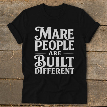 Black t-shirt with white text that reads "Mare people are built different".