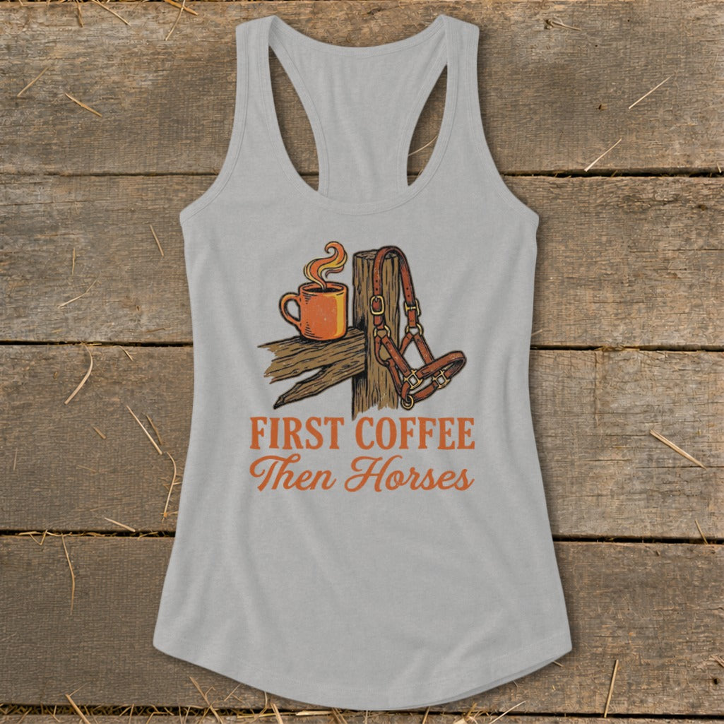 Grey tank top with illustration of coffee cup, halter, and text "First Coffee Then Horses".