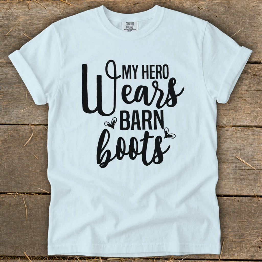 White t-shirt with black text that reads "MY HERO Wears BARN boots."