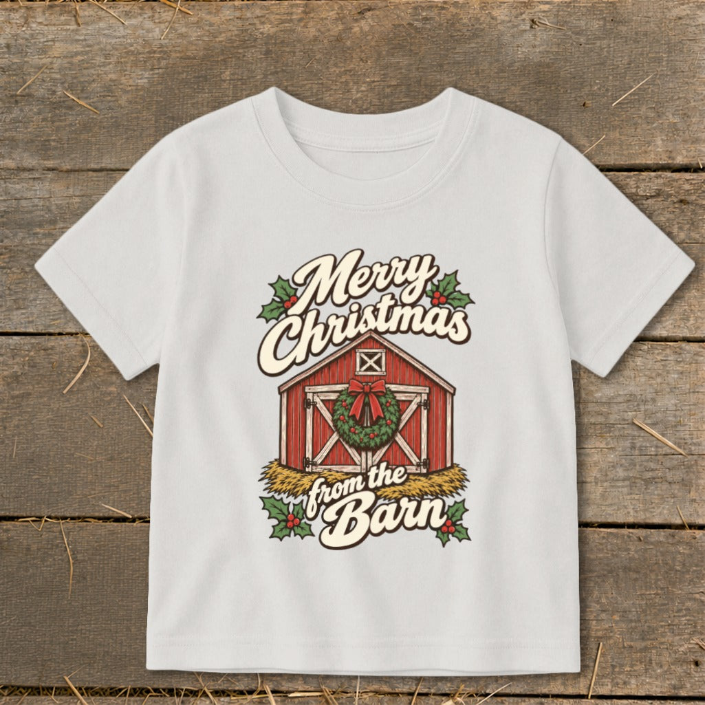 White t-shirt with red barn, wreath, and "Merry Christmas from the Barn" text.