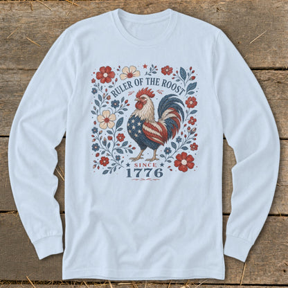 Rooster with American flag design on a light blue long-sleeve shirt with floral border and "Since 1776" text.