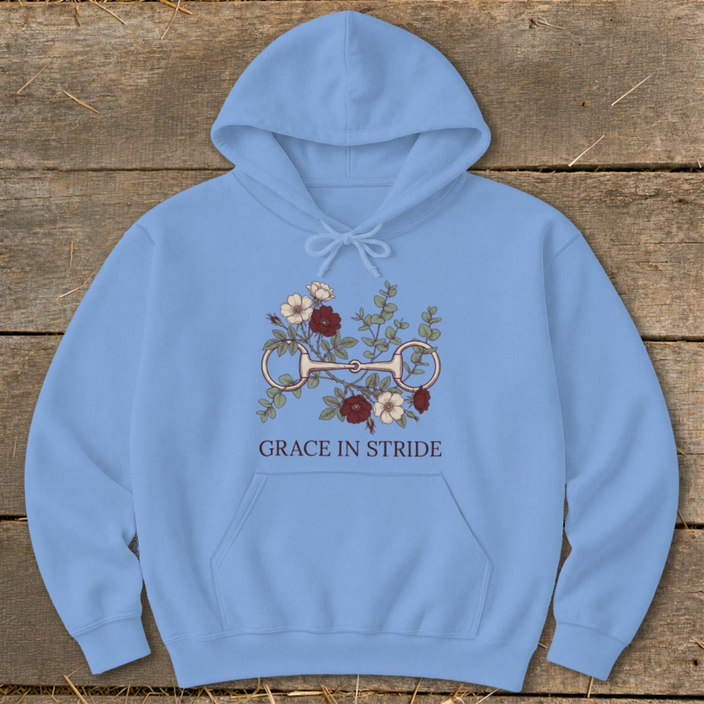 Light blue hoodie with horse bit and floral graphic, "GRACE IN STRIDE" text.