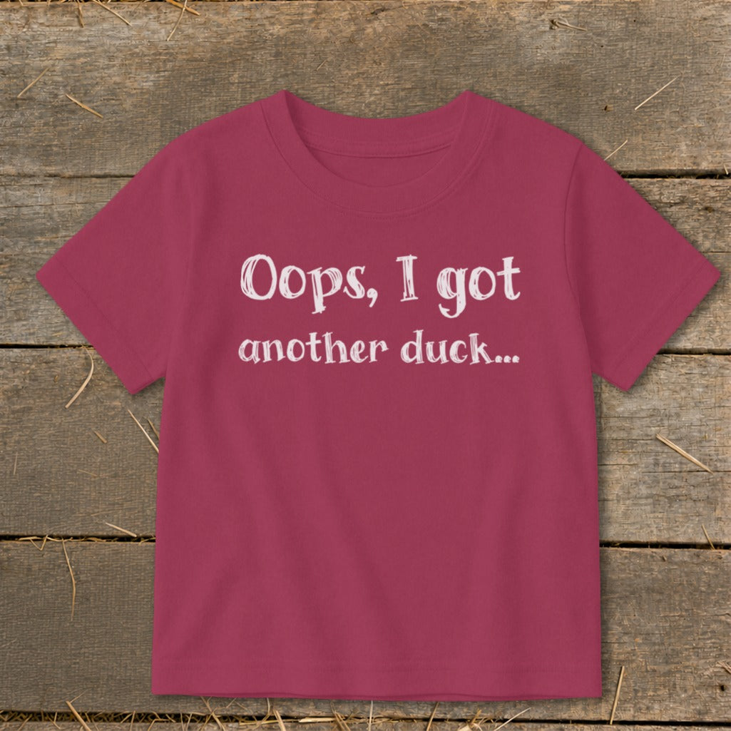 Pink t-shirt with white text that reads "Oops, I got another duck..."