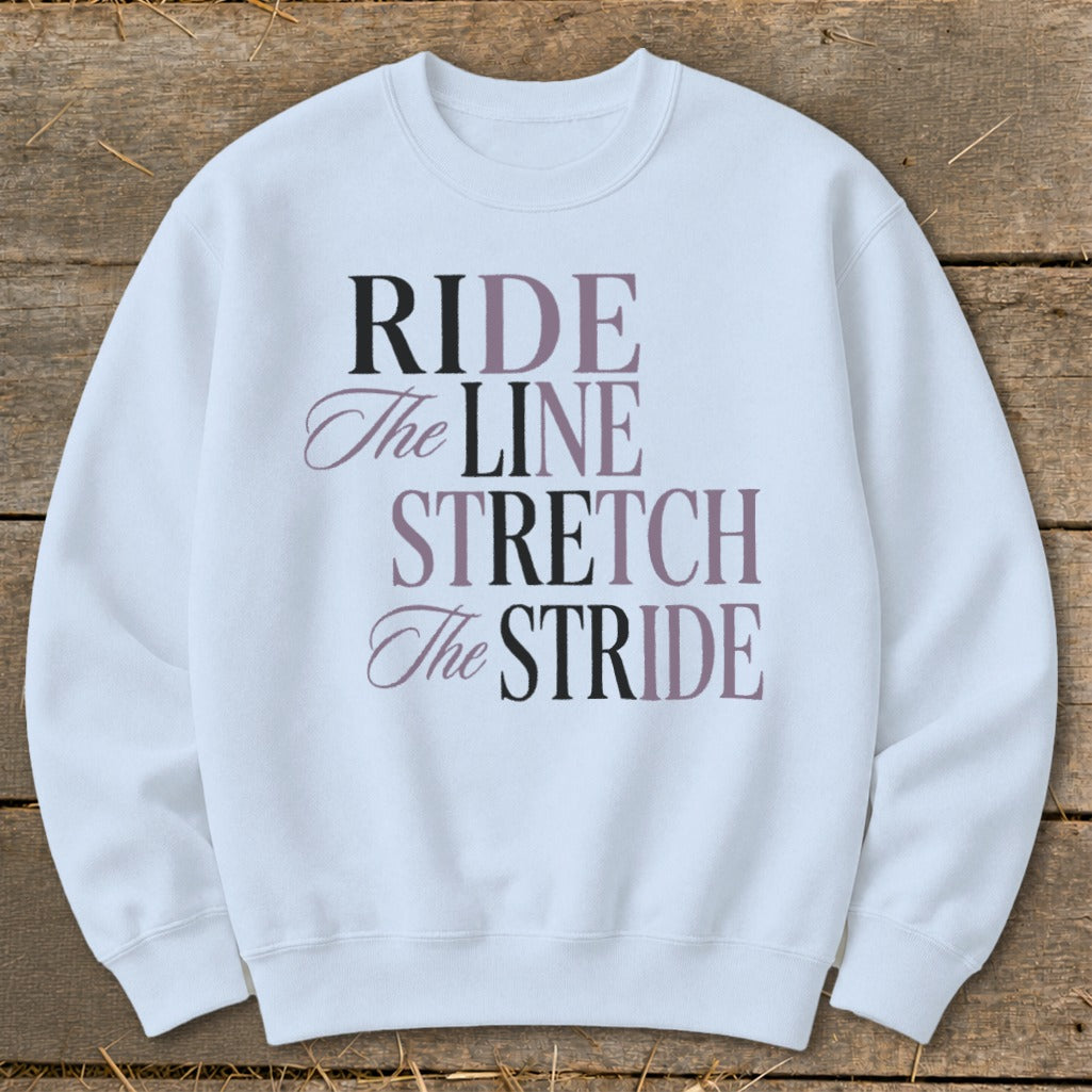 White sweatshirt with text "RIDE The LINE STRETCH The STRIDE".