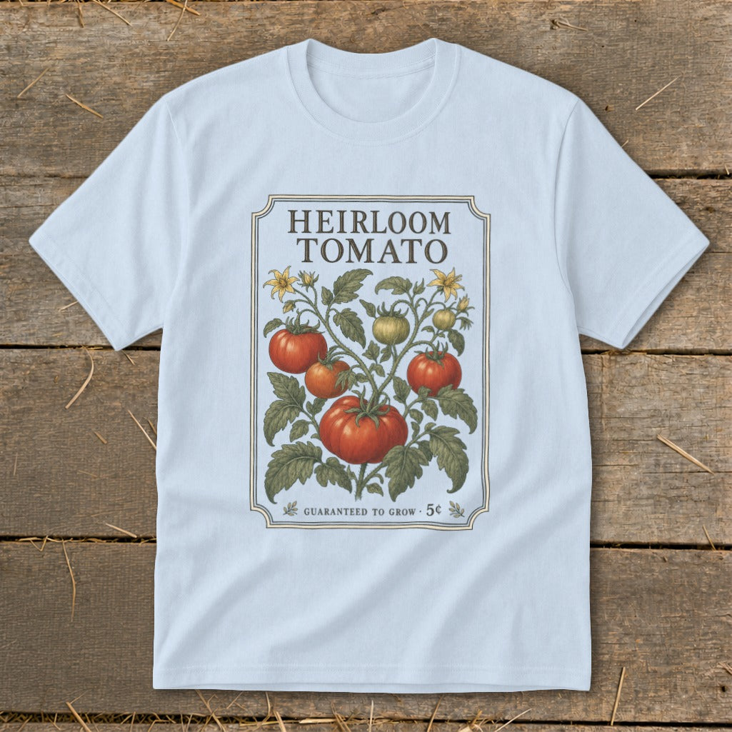 Light blue t-shirt with "Heirloom Tomato" design featuring tomato vine and "Guaranteed to Grow 5¢".
