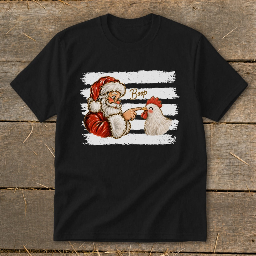 Santa boops a chicken with the word "Boop" above them on a black t-shirt.