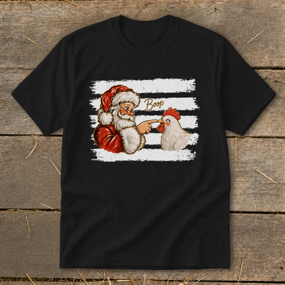 Santa boops a chicken with the word "Boop" above them on a black t-shirt.