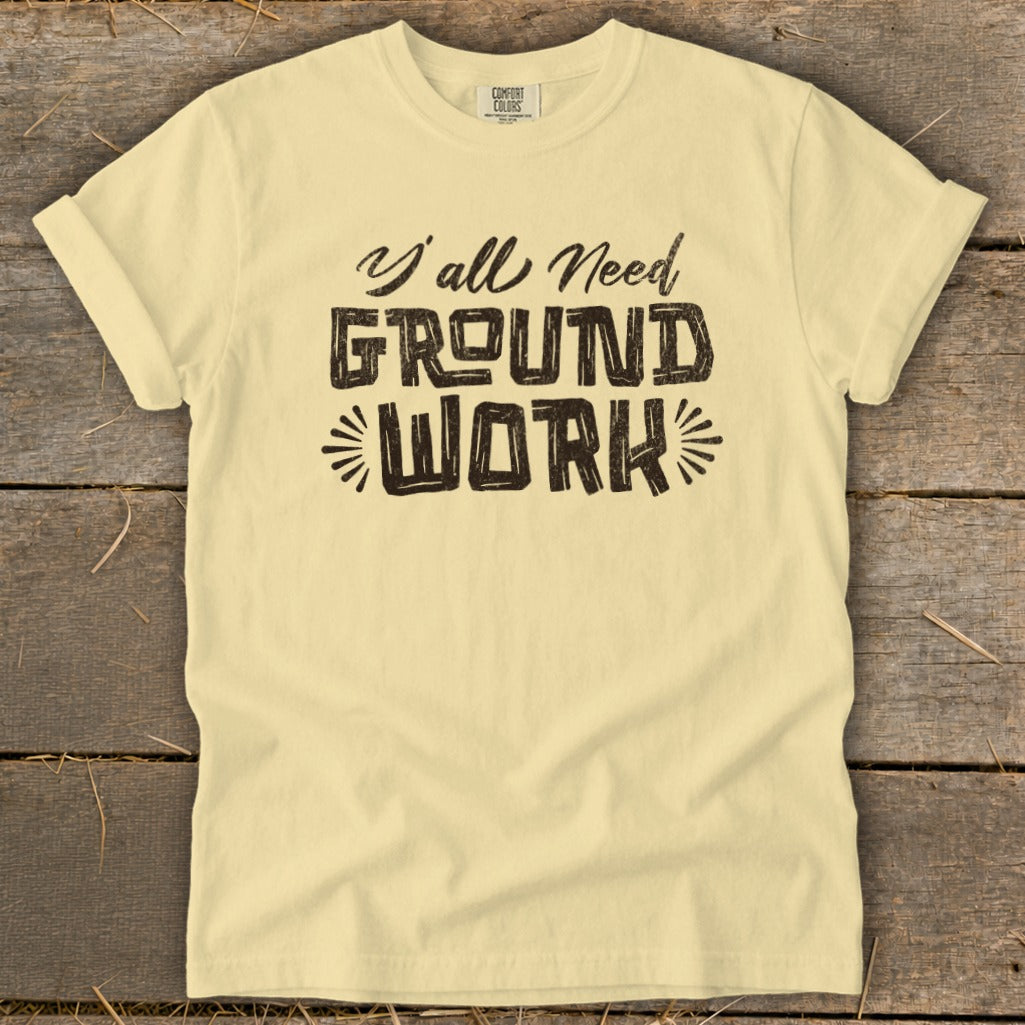 Light yellow t-shirt with "Y'all Need Ground Work" text in distressed black font.