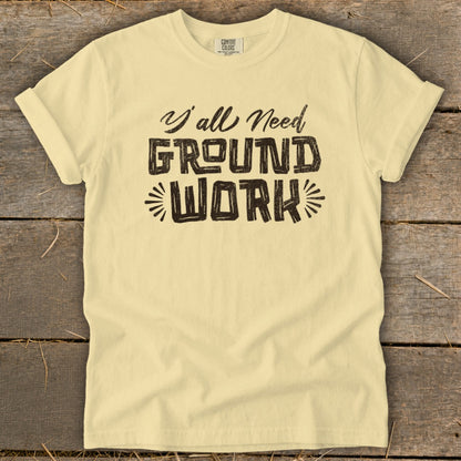 Light yellow t-shirt with "Y'all Need Ground Work" text in distressed black font.