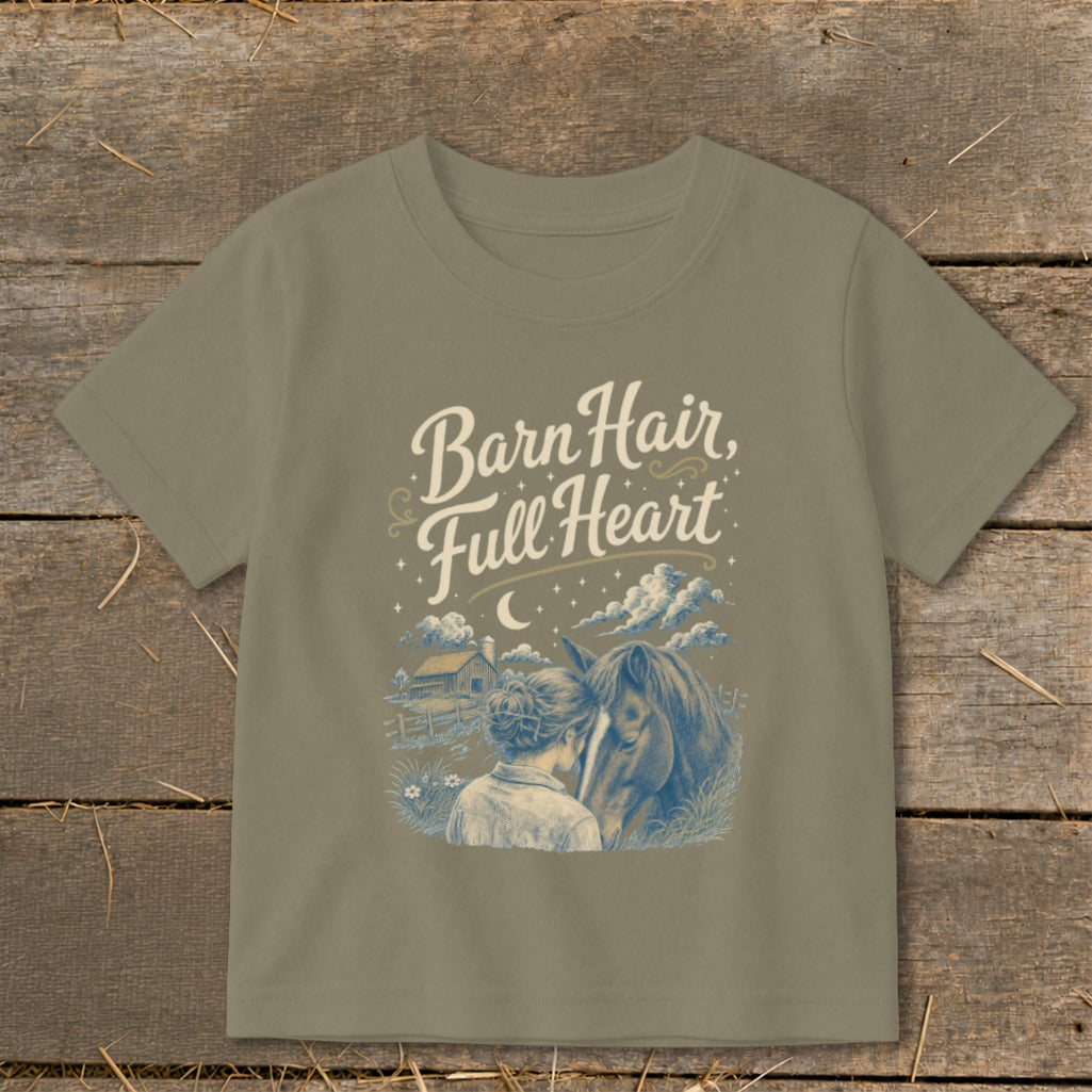 T-shirt with "Barn Hair, Full Heart" text over a girl and horse in a farm scene.