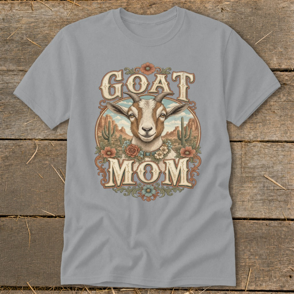 Grey t-shirt with a desert scene and goat graphic that reads "GOAT MOM".