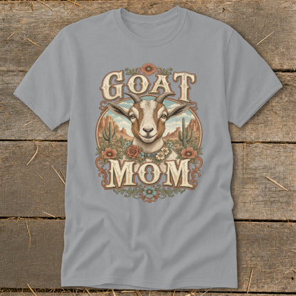 Grey t-shirt with a desert scene and goat graphic that reads "GOAT MOM".