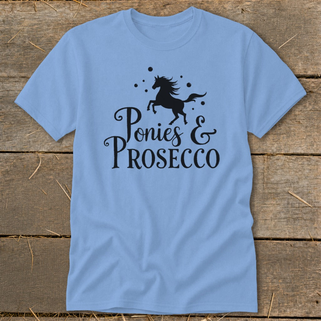 Light blue t-shirt with black graphic that says "Ponies & PROSECCO".