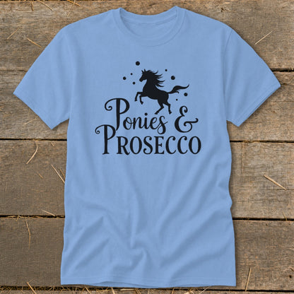 Light blue t-shirt with black graphic that says "Ponies & PROSECCO".