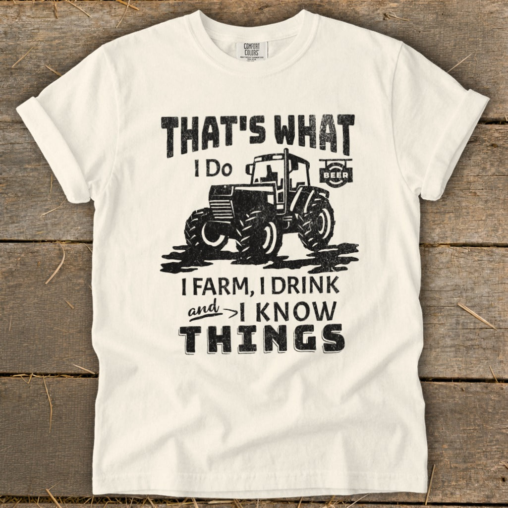 Cream t-shirt with distressed graphic of tractor and text "That's What I Do".