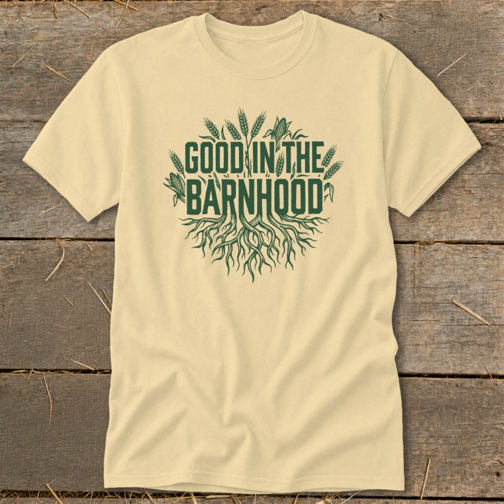 Light yellow t-shirt with green text "GOOD IN THE BARNHOOD" and roots graphic.