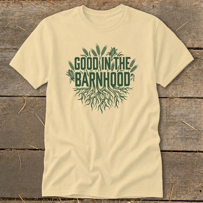 Light yellow t-shirt with green text "GOOD IN THE BARNHOOD" and roots graphic.