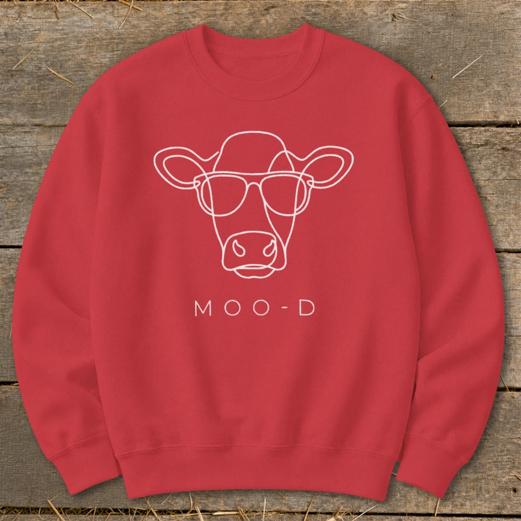 Red sweatshirt with white line drawing of a cow wearing sunglasses and text MOO-D.