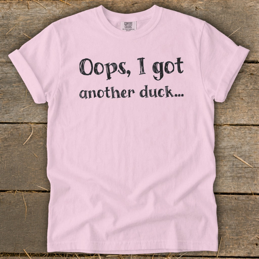 Pink t-shirt with black text that reads "Oops, I got another duck..."
